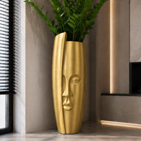 Wysoka złota donica Twarz 90 cm - designerska donica dekoracyjna Premium