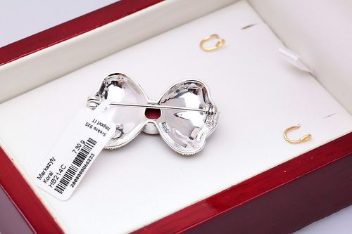 broszka srebrna kokarda z markazytami i koralem na Arena.pl