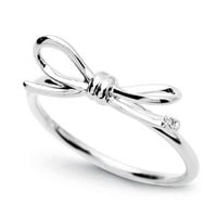 pierścionek - kokardka z białego złota z diamencikiem