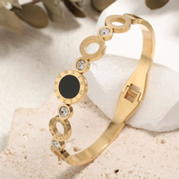 Bransoletka damska złota sztywna stal chirurgiczna elegancka z cyrkoniami