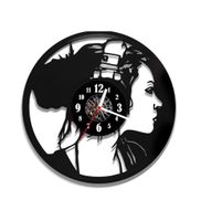 Zegar ścienny z płyty winylowej Kobieta ze słuchawkami 65.2