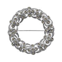 srebrna piękna okrągła broszka z markazytami