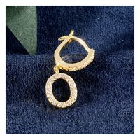 Kolczyki pozłacane literka O KST1683O