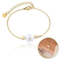 bransoletka na rękę stal chirurgiczna pozłacana 14k złotem, biały kwiat