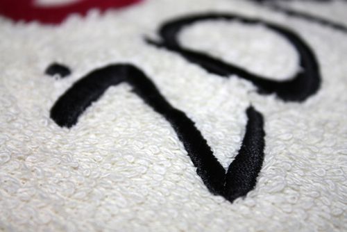 Bawełniane ręczniki haft komputerowy TANIO logo na Arena.pl